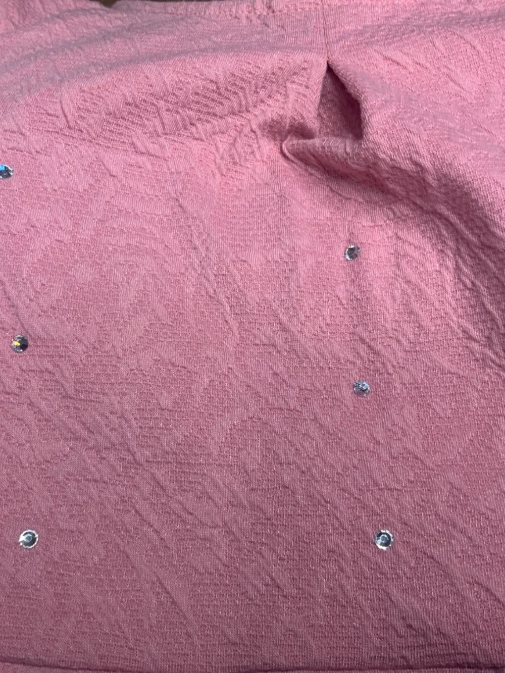 Dusty pink dress with pleated skirt and rhinestones.